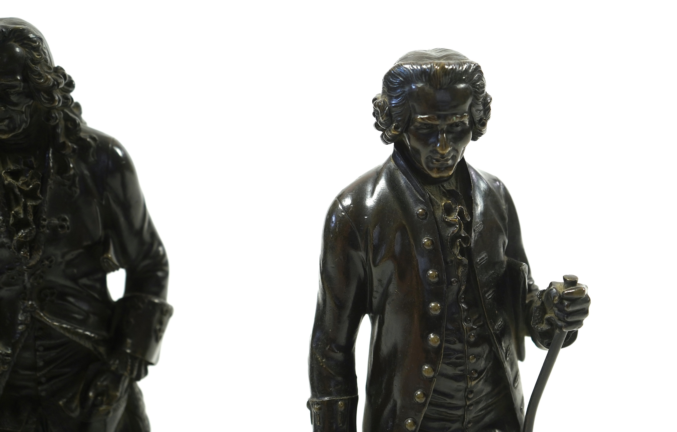 After Jean-Claude-Joseph Rosset (1706-1786), two patinated bronze figures of Voltaire and Jean-Jacques Rousseau, 19th century
